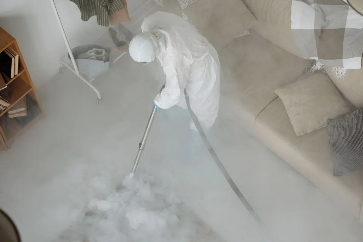 Biohazard cleanup technician in protective equipment, Uniontown, AL